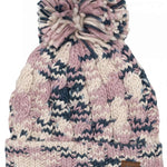 The 686 Ladies Chunky Rib Cuffed Beanie 2024 is predominantly pink and white with dark blue accents, featuring a chunky knit pattern and a cuffed hem.