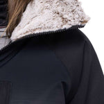 The 686 Women's Dream Insulated Jacket 2023 is black with a thick, off-white faux fur-lined hood.