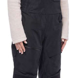 The women's 686 Geode Thermagraph bib features a black insulated snowboard bib with a zippered fly and adjustable straps.
