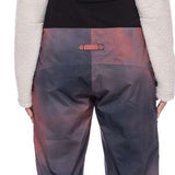 The 686 Women's Geode Thermagraph Bib 2023 features a gray and pink color scheme with an insulated hood.