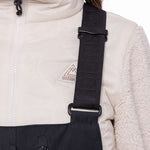 The 686 Women's Geode Thermagraph Bib features a black front with a quilted pattern and a white logo on the left hip.
