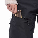 The 686 Women's Geode Thermagraph Bib from the waist down with black straps on the sides and a zippered pocket at the back.