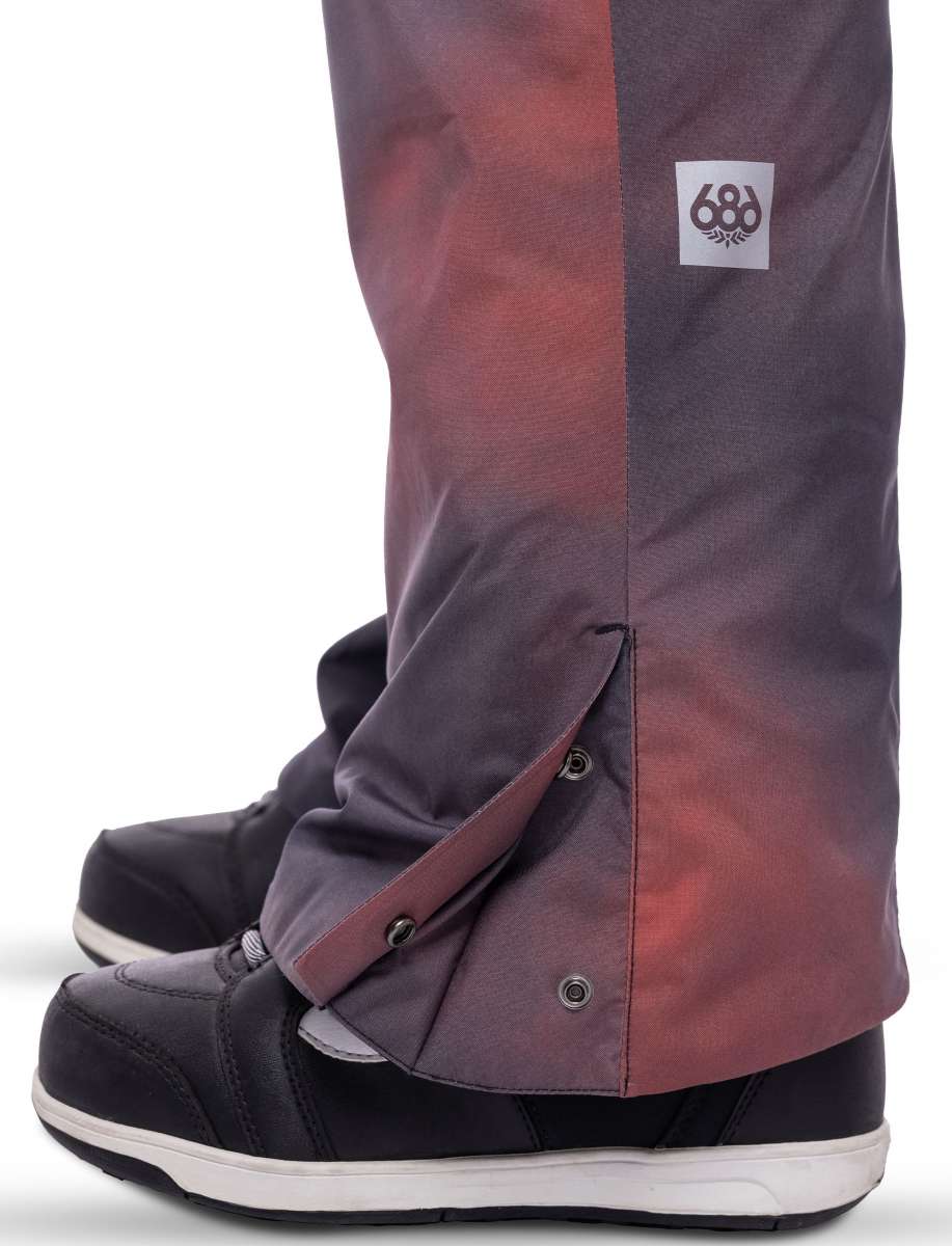 The 686 Women's Geode Thermagraph Bib 2023 in a rich purple color has an insulated hood and is shown from a front view.