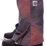 The 686 Women's Geode Thermagraph Bib 2023 in a rich purple color has an insulated hood and is shown from a front view.