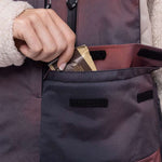 The 686 Geode Thermagraph bib in pink and purple has an insulated hood.