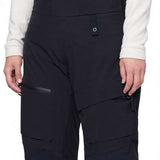 The 686 Women's Geodge Thermagraph Bib features black bib legs with a zippered front and a visible insulated thermal lining.