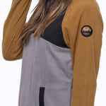 The 686 Ladies Hemlock Fleece Hoodie from 2023 is primarily tan with a gray back and an insulated hood.