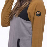 The 686 Ladies Hemlock Fleece Hoodie from 2023 is primarily tan with a gray back and an insulated hood.