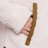 The 686 Ladies Hemlock Fleece Hoodie 2023 is cream-colored with an insulated hood and a brown drawstring.