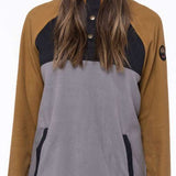 The 686 Ladies Hemlock Fleece Hoodie 2023 is primarily tan with black accents and has an insulated hood.