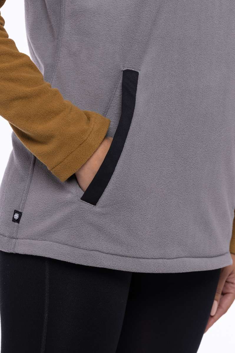 The 686 Ladies Hemlock Fleece Hoodie in light grey has an insulated hood and two side pockets with black trim.
