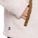 The 686 Ladies Hemlock Fleece Hoodie in cream has an insulated hood and a brown drawstring.