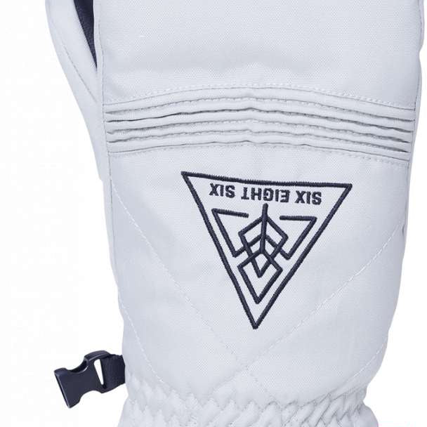 The 686 Women's Jubilee Mitten 2024 is predominantly white with black accents and has an insulated hood.