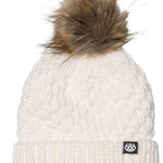 The 686 Majesty Beanie has a white cable knit design with a brown faux fur pom-pom on top.