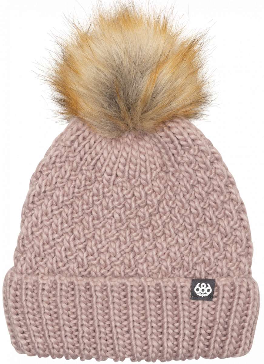 The 686 Ladies Majesty Cable Knit Beanie from the front view features a dusty rose color with a faux fur pom-pom on top.