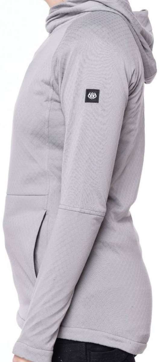 The 686 Ladies Mission Grid Fleece Hoodie 2023 is light gray with an insulated hood and a logo patch on the left sleeve.