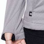 The 686 Ladies Mission Grid Fleece Hoodie 2023 has an insulated hood with a black interior lining and is light grey in color.