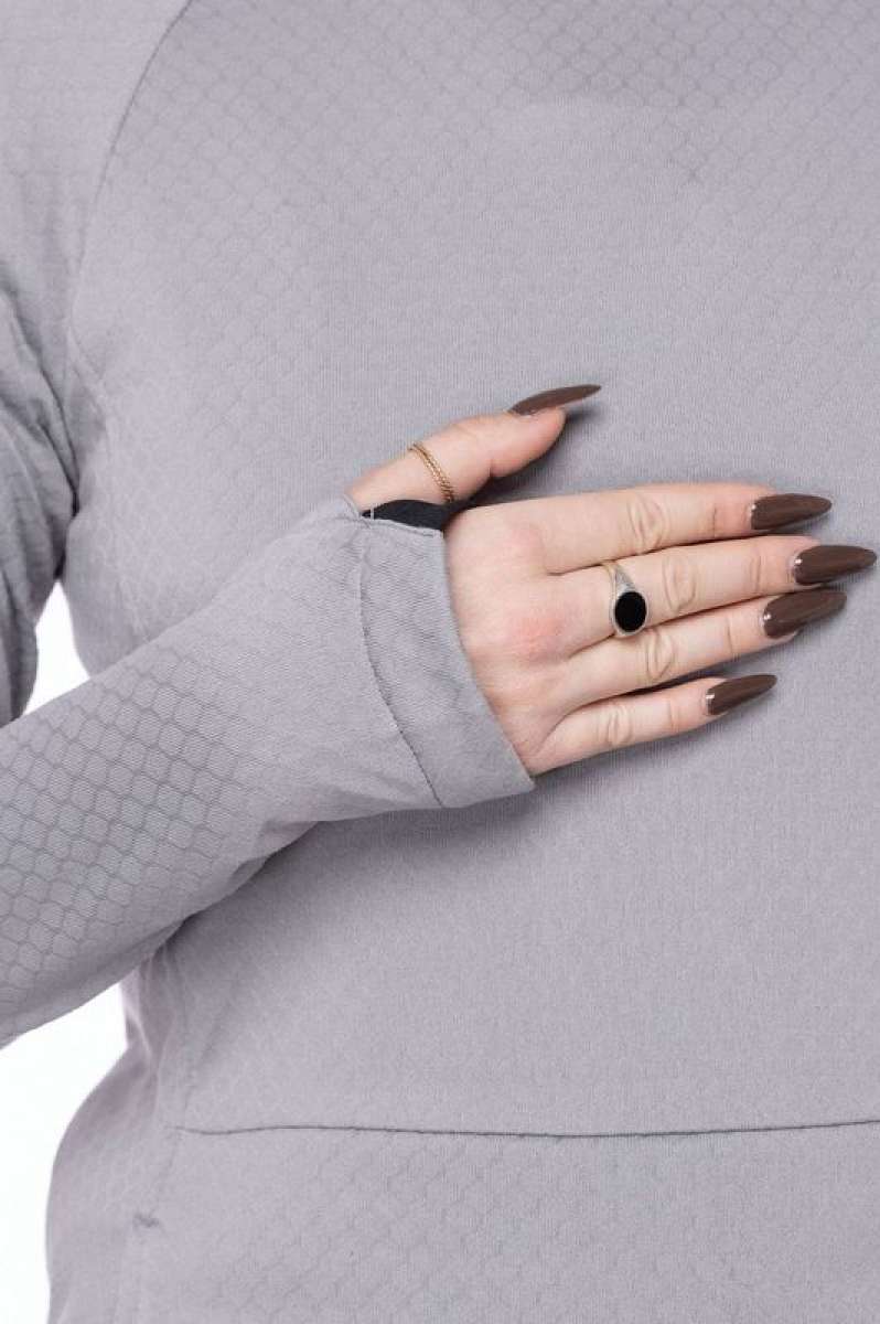 The 686 Ladies Mission Grid Fleece Hoodie 2023 features a light gray color with a subtle grid pattern and an insulated hood visible on a front view.