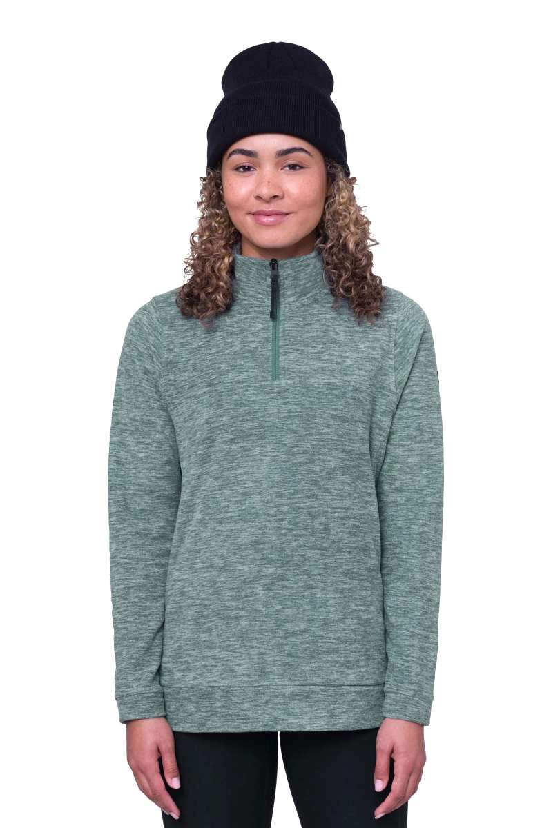 The 686 Women's Quarter Zip Fleece 2024 is primarily green with white accents and appears to be in a front view.
