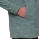 The 686 Women's Quarter Zip Fleece 2024 is a heather green fleece with a quarter-zip front and thumbholes in the sleeves.