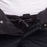 The 686 Women's Smarty 3-in-1 Cargo Pant has a black quilted waistband and cuffs with silver zippers on a black background.