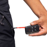 The 686 Women's Smarty 3-in-1 Cargo Pant 2024 is primarily black with a zippered side pocket and two cargo pockets on each leg.