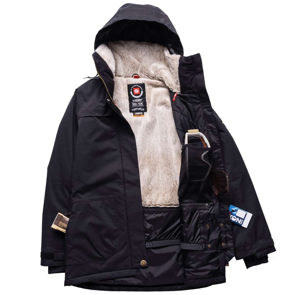 The 686 Women's Spirit Insulated Jacket 2024 is predominantly black with a white faux fur lining and red zipper pull on the front.