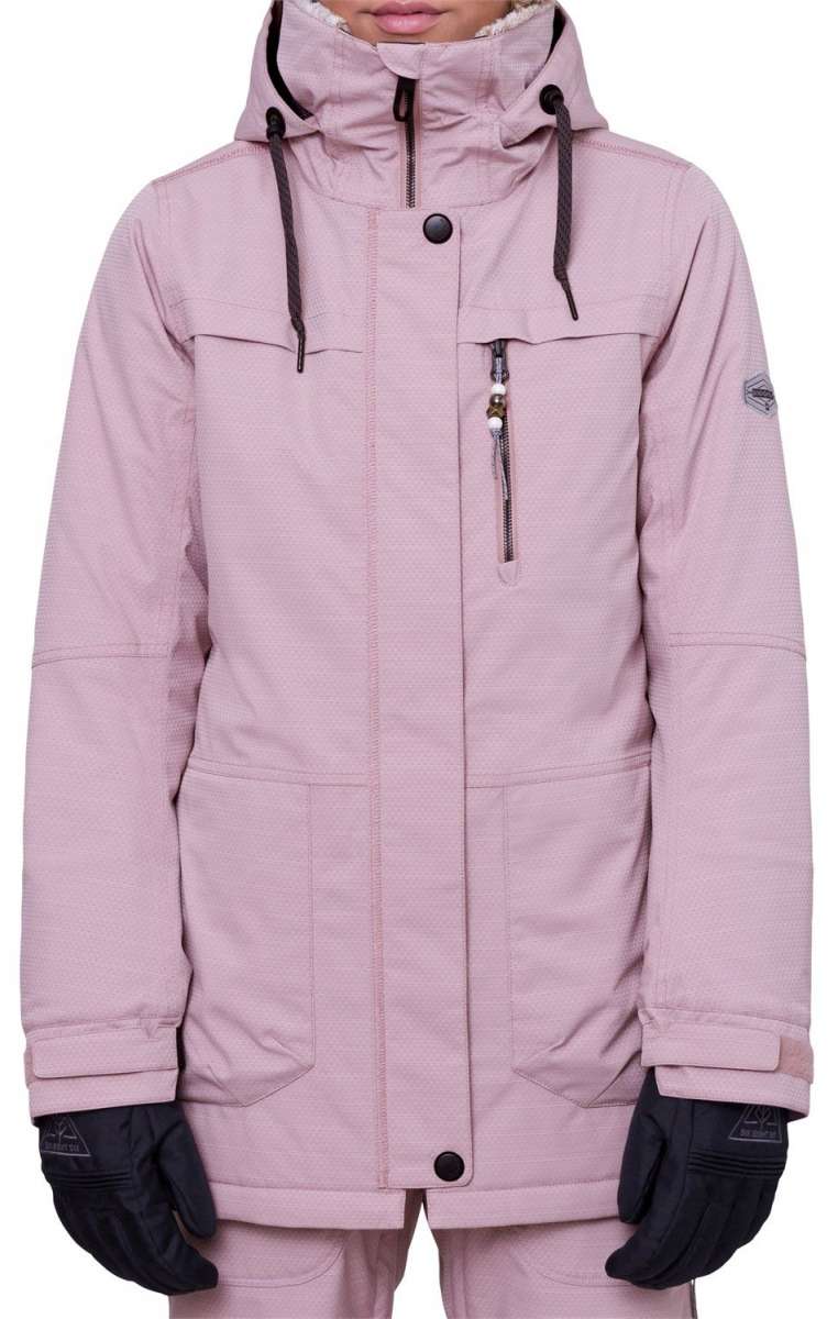 The 686 Women's Spirit Insulated Jacket in light pink has an insulated hood and a zippered chest pocket.