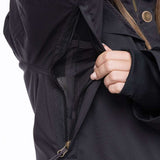 The 686 Women's Spirit Insulated Jacket 2024 has an insulated hood and is black with zippered pockets on the front.