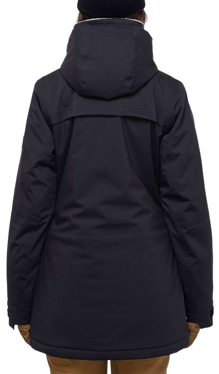 The 686 Women's Spirit Insulated Jacket 2024 is shown in black from the rear view, highlighting its insulated hood and adjustable waist buckle.