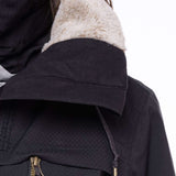 The 686 Women's Spirit Insulated Jacket 2024 has a thick, off-white faux fur trim along its hood and collar.