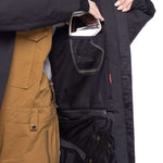 The 686 Women's Spirit Insulated Jacket 2024 is shown from the front in black with a zippered chest pocket and two lower pockets.