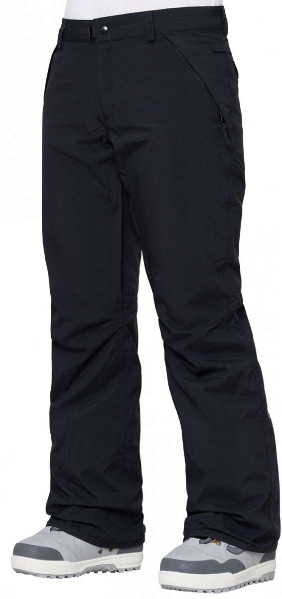 The 686 Women's Standard Shell Pant 2024 is black with a belt loop at the waist and two zippered front pockets.