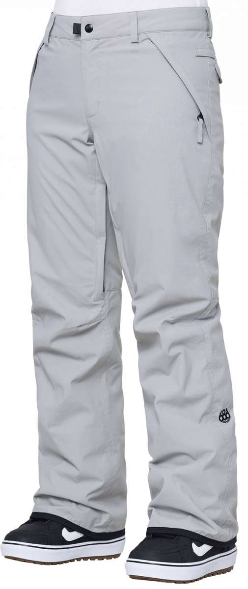 The 686 Women's Standard Shell Pant 2024 is primarily light grey with black accents and has zippered pockets at each side.