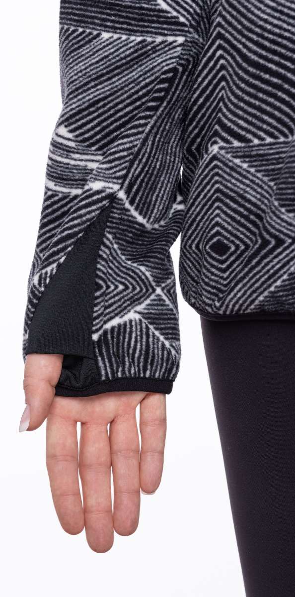 The 686 Tioga fleece pullover has a black and white geometric pattern with a solid black trim around the wrists.