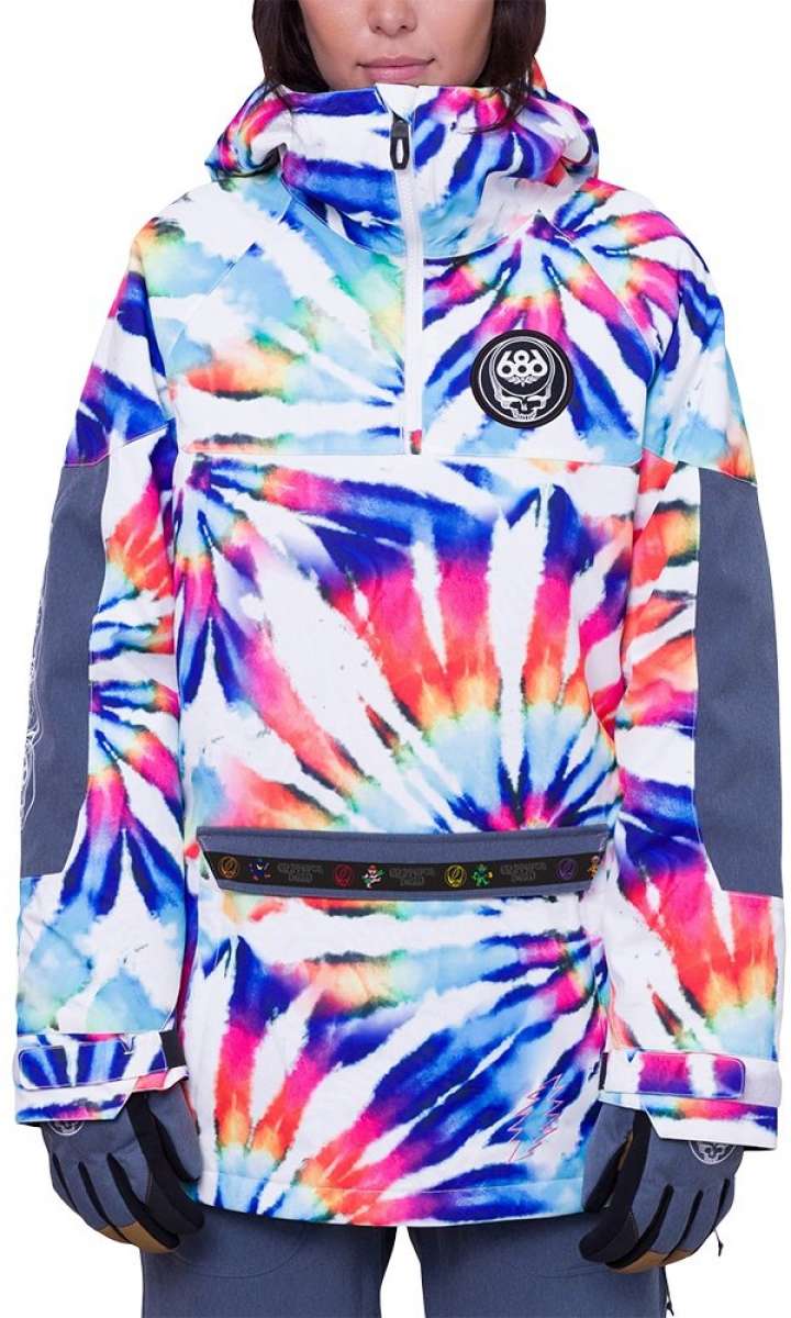 The 686 Women's Upton Insulated Anorak Jacket 2024 is predominantly white with a tie-dye design in shades of pink, blue, and orange.