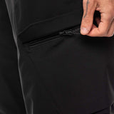 The 686 Quantum Thermagraph Pant 2024 is black with a zippered front pocket on the right side, as seen in this close-up view.