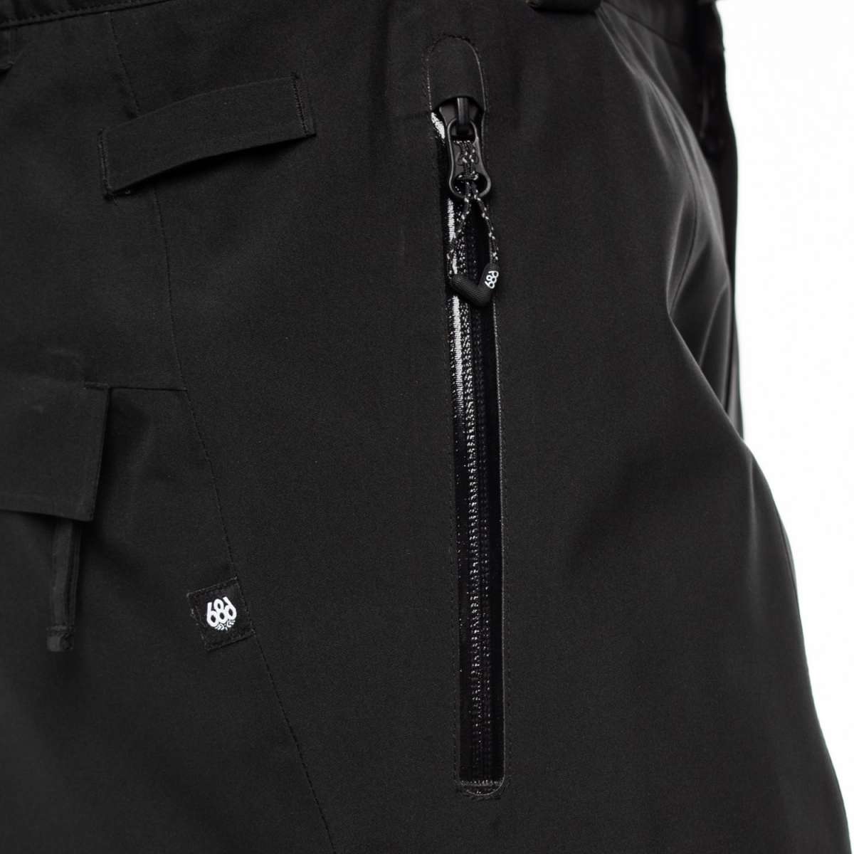 The 686 Quantum Thermagraph Pant 2024 is black with a zippered fly and an adjustable waistband.