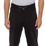The 686 Smarty 3-in-1 Cargo Pant in black has multiple zippered cargo pockets on each leg.