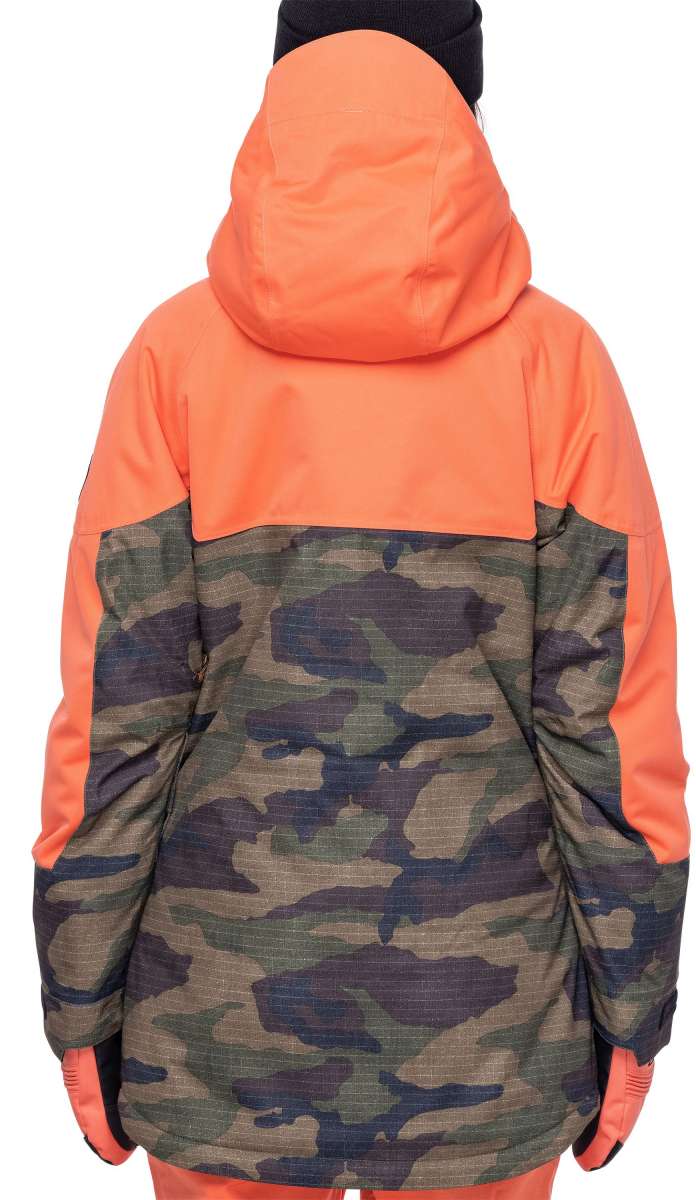 The 686 Ladies' Upton Insulated Jacket 2023 has an orange upper section and camouflage patterned lower section with a black hood.