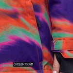 The 686 Ladies' Upton Insulated Jacket 2023 has an orange base color with purple swirls and a black logo on the left chest.