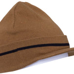 The 686 Visor Knit Beanie 2024 is tan with a black stripe across the front and visor brim at the back.