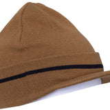 The 686 Visor Knit Beanie 2024 is tan with a black stripe across the front and visor brim at the back.