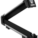 Thule Snowpack M 4 Pairs - Black roof rack with four pairs of cross-country ski holders and a gray button on top.