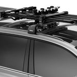 Thule Snowpack M 4 Pairs - This image shows a black roof rack with four pairs of skis mounted on top.