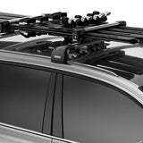 Thule Snowpack M 4 Pairs - This image shows a black roof rack with four pairs of skis mounted on top.