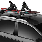 Thule Snowpack M 4 Pairs - 7324 - Black roof rack with four ski and snowboard carriers attached.