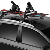 Thule Snowpack M 4 Pairs - 7324 - Black roof rack with four ski and snowboard carriers attached.