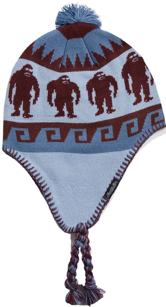 Airblaster Squatchamama Beanie 2023 - A light blue beanie with a brown pattern of Bigfoot-like creatures and geometric shapes.
