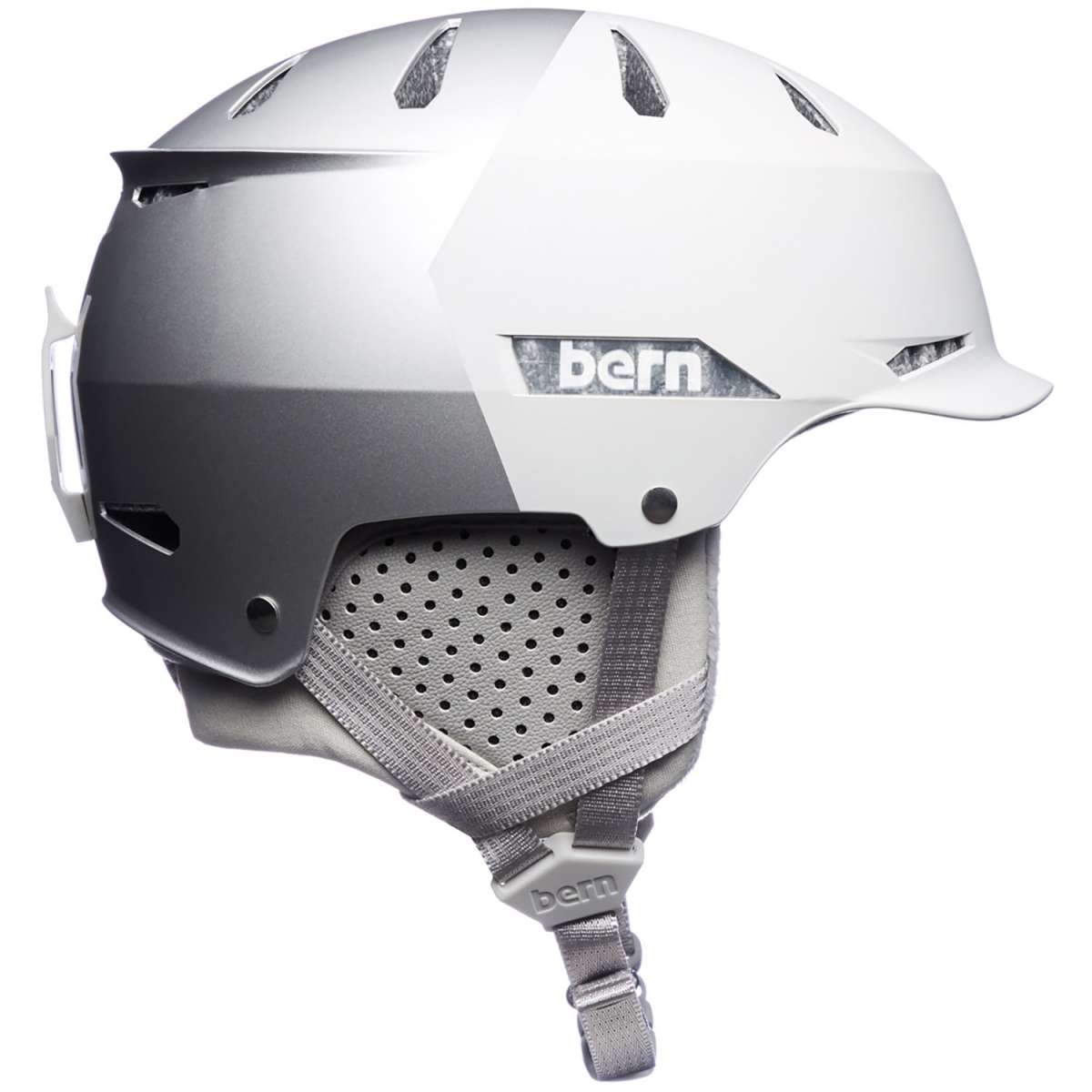 Bern Hendrix MIPS Helmet 2024 - A white helmet with a black visor and MIPS technology, featuring ventilation holes on top and a strap at the back.